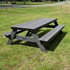 A frame outdoor picnic table with painted grey frame and grey composite timber on grass.