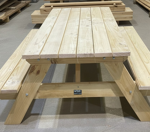 Pine A Frame picnic table with benches on a concrete floor