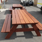 Jarrah A Frame picnic table on a concrete surface with a vehicle in the background