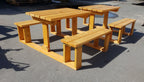 A pine 4 seater U shape picnic table in sunshine