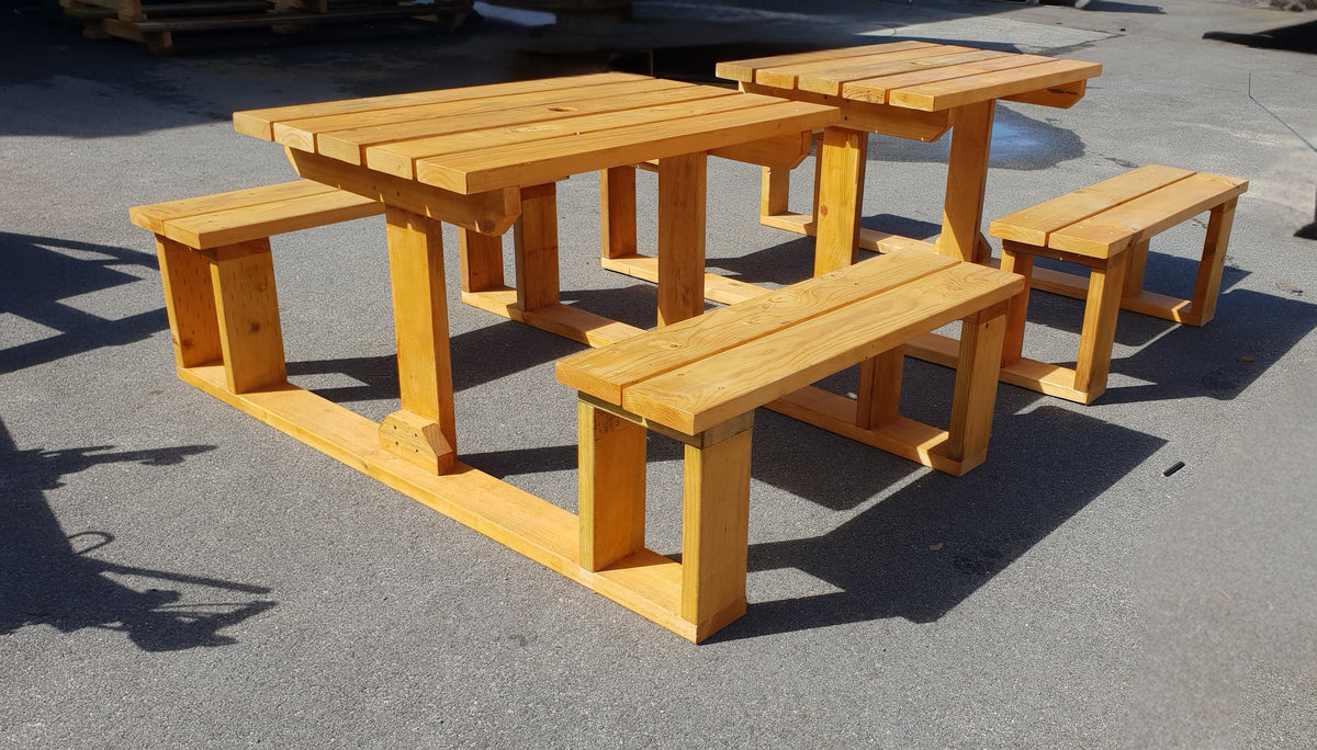 A pine 4 seater U shape picnic table in sunshine